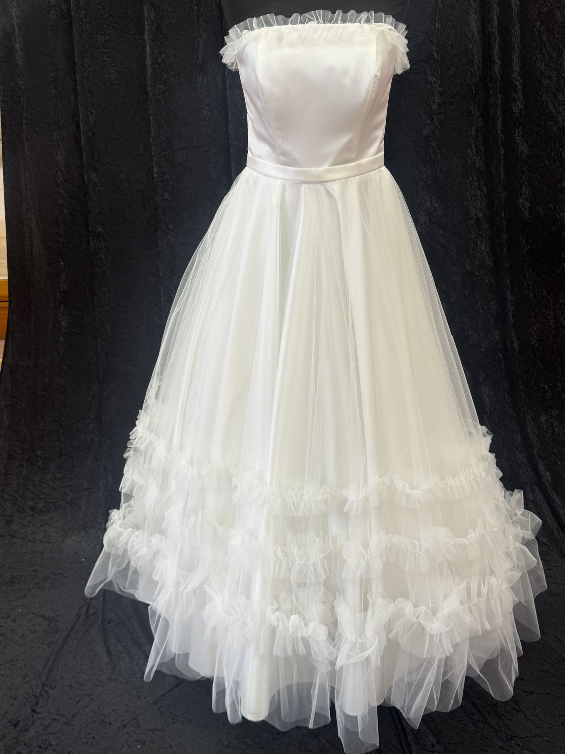 Strapless ruffled tulle wedding gown at Brides of Bond Street, Leicester