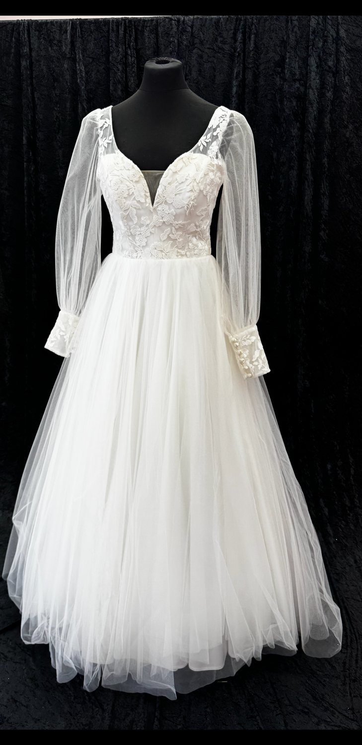 Long-sleeved lace and tulle wedding gown at Brides of Bond Street, Leicester